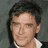 A pixelated image divided into four quadrants with a person's face in the top-left and text on green backgrounds.