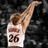 Pixelated image of a basketball player in mid-air shooting, wearing white jersey with number 26 and brown hair.