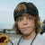 A 2x2 contact sheet of a static animated icon featuring a person with light brown hair wearing a dark cap and white shirt, alongside red text on black backgrounds.