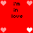 Red background with pixelated hearts and text 'i'm in love' arranged in a pattern