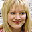 Four -aligned headshots of a person with blonde hair and dark-haired person, showing different expressions across two