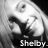 Black-and-white pixelated image of a person with dark hair and light clothing, featuring visible text at the bottom.