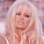 Static 50x50 pixel icon showing a close-up of a person with long blonde hair and light skin tone, rendered in low-resolution pixel art style with visible dithering and color blending.