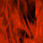 A static image with a red and black abstract pattern on the left, transitioning to solid gray on the right.