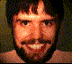 pixelated images showing a person's face transitioning from normal to green-skinned, fanged, and aggressive expressions