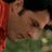Pixelated image of a person in red clothing with green background, paired with pixelated text reading 'i know it sucks... but i love you to mmy!' on white and gray