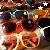 Animated sequence of stylized sunglasses with orange outlines and red lenses, set against a dark background with white and yellow stars.