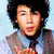 A four- shows a person with dark curly hair in different poses and clothing: light blue shirt with tie, red polo shirt, white striped shirt
