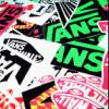A dense collage of overlapping graphic elements featuring bold text, geometric patterns, and stylized symbols in high-contrast colors.