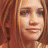 A 48x48 pixel buddy icon split into two sections: a left-side portrait of a person with light brown hair and a right-side green background with bright green text reading "Original Icons .com".