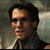 A split-frame contact sheet showing a pixelated character portrait on the left and green text logo on the right against a gray background.