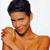 Pixelated image of a person with short dark hair, light brown skin, and a black choker necklace, wearing an orange sleeveless top against a white background.
