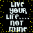 Pixelated text repeats 'LIVE YOUR LIFE... NOT MINE' on a black background with scattered yellow dots, animated to shift vertically.