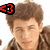 A person with brown hair and a brown jacket appears in four with red and black symbols changing position