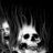 Black-and-white animated icon shows a skull with glowing eyes and a fiery background, with subtle motion in the flames and skull's expression.