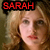 A 50x50 pixel animated buddy icon featuring a side-by-side contact sheet of two frames showing the same woman with blonde hair and red lipstick, each frame displaying "SARAH" in bold red text at the top against a black background.