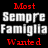 Two side-by-side pixelated text images with 'Most Sempre Famiglia Wanted' in red and gray on black background versus white background.