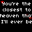 Pixelated text repeats 'You're the closest to heaven that I'll ever be' with red star accents on black background, partially cropped at right.