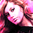 Pixelated close-up of a person with light brown hair, pink-toned skin, and dark clothing against a bright background.