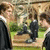 A four- animated sequence showing two figures in dark robes on a grassy hill, with text overlays changing