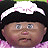 Pixelated close-up of a child's face wearing a black hat with white trim and pink clothing, static image.