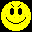 Four yellow pixelated smiley faces with distinct expressions arranged in a on black background, each face showing unique mouth and eye details