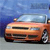 A static pixelated image of a light brown convertible car with a clear windshield, positioned on a gray surface under a blue sky background.