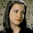 A pixelated contact sheet showing two frames of an animated buddy icon with a person's face on the left and blue text reading "jersey girl" on the right against a white background.