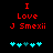 Red pixelated text reads "I Love J Smexii" above cyan and teal puzzle pieces on a black background.