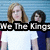 Two people stand side-by-side against a blue striped background with bold text overlay reading "We The Kings" in white letters on black bars.