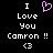 Pixelated text and symbols on black background with pink heart symbol above 'I Love You Camron !!' and white heart symbol below.