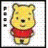 Pixelated yellow bear with brown nose and eyes, wearing red shirt, standing against white background.