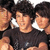 A pixelated image of three people in a group pose with text overlays reading "OH MY JONAS!" and "OMJ" on separate