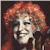 A pixelated contact sheet showing two frames of an animated icon featuring a woman with red hair and green text reading "Original Icons .com" on the right side.