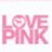 Pixelated pink text reading LOVE PINK on a light background with faint pastel speckles.
