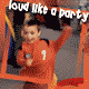 A child in a red shirt with number 7 dances in a playground, surrounded by orange and yellow structures, with 'loud like a party' text above.