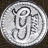 Static circular icon with pixelated silver and gray tones featuring a stylized 'G' logo inside, set against a dark background.