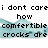 Pixelated text and light blue crock-style shoes on white background with gray rectangle.
