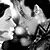 Animated sequence showing two figures in close proximity, one with light hair and the other with dark hair, transitioning between intimate poses.