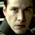 A 2x2 contact sheet of a Matrix-themed animated buddy icon featuring Keanu Reeves as Neo with pixelated text on the right side.
