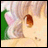A pixelated anime-style close-up of a character's face with pink ears and brown eyes on the left, next to black background text reading "AnimeIM" above "com" in white pixelated font.