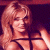 Pixelated image of a person with long blonde hair wearing dark straps, positioned next to green text reading 'Original Icons .com' on a solid background.
