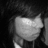 A grayscale pixelated image of a rounded object with smooth shading against a dark background, appearing as a stylized light source or abstract shape.