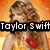 Pixelated image of a person with curly hair wearing a yellow dress and red flower, overlaid with text "Taylor Swift".
