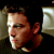 Static 50x50 pixel icon showing a close-up of a person's face with dark hair and light skin, partially cropped on the right side against a dark background.