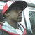 A person wearing a red and white striped cap and red-trimmed shirt appears in three showing slight head movement