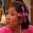 A person in a pink top with dark hair and pink flower accessories appears in three sequential expressions: neutral, surprised, and open-mouthed.