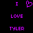 Purple pixelated text and heart symbol on black background, arranged in three with 'I' on top, 'LOVE' in middle, 'TYLER' at bottom