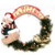 A circular wreath composed of a light brown branch with a red bow at the top, surrounding a central white space with a partial figure on the left.