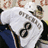 A pixelated image shows a person in a white shirt with black symbols, next to blue background text reading "GO CAPS!".